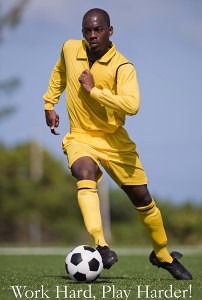 Soccer player running with the ball.